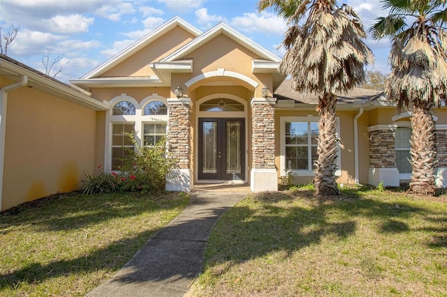 property entrance with a yard