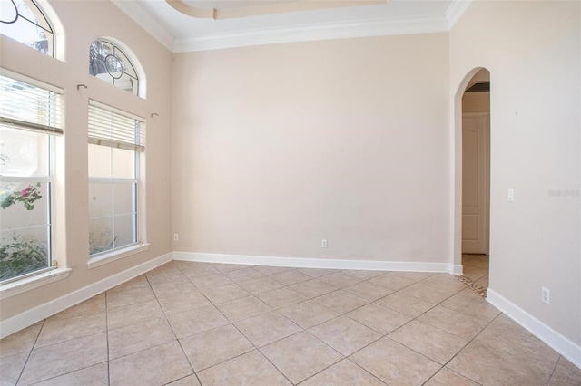 unfurnished room featuring ornamental molding and light tile patterned flooring