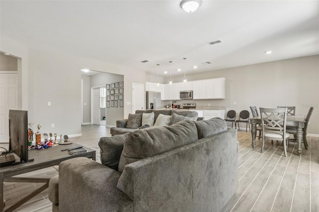 living room with light wood-type flooring