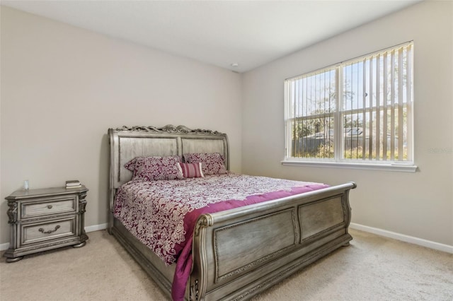 bedroom with light carpet