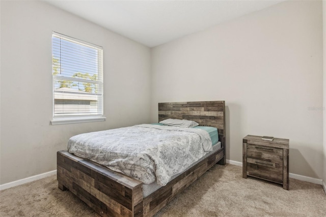 bedroom featuring light colored carpet