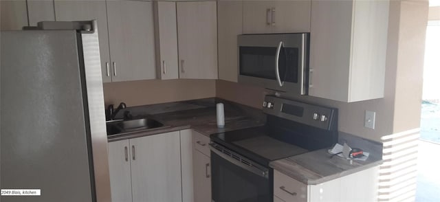 kitchen featuring stainless steel appliances and sink