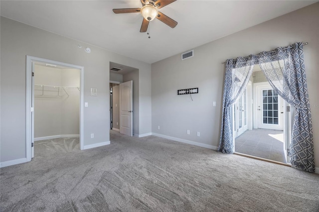 interior space featuring ceiling fan