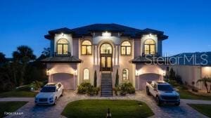 mediterranean / spanish-style house featuring a garage