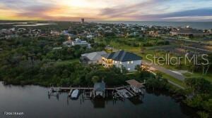 aerial view at dusk with a water view