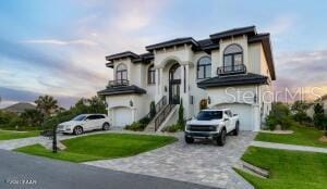 801 N Flagler Ave, Flagler Beach, FL 32136 - view of front facade featuring a garage and a lawn