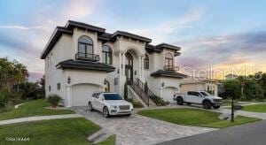 801 N Flagler Ave, Flagler Beach, FL 32136 - view of front facade featuring a yard and a garage