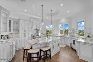 801 N Flagler Ave, Flagler Beach, FL 32136 - kitchen featuring white cabinetry and a kitchen bar
