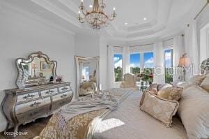 801 N Flagler Ave, Flagler Beach, FL 32136 - bedroom with a tray ceiling, a notable chandelier, crown molding, and a towering ceiling