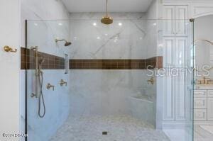 801 N Flagler Ave, Flagler Beach, FL 32136 - bathroom featuring vanity and a tile shower