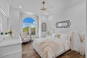 801 N Flagler Ave, Flagler Beach, FL 32136 - bedroom with crown molding, dark hardwood / wood-style floors, access to outside, and ceiling fan