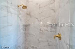 801 N Flagler Ave, Flagler Beach, FL 32136 - bathroom featuring tiled shower