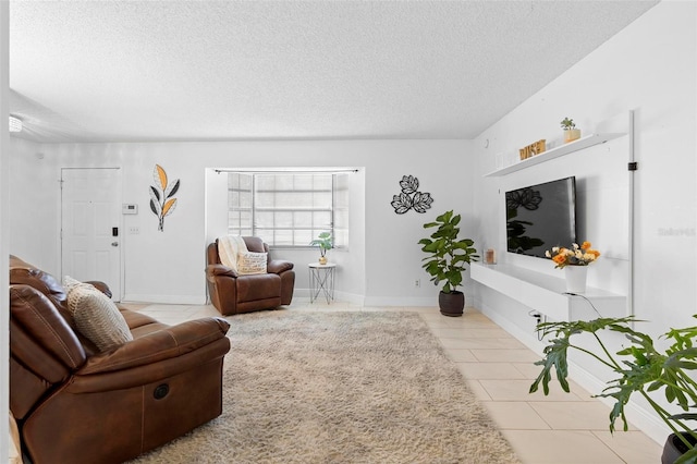 living room with light tile patterned flooring and a textured ceiling