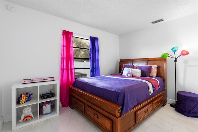 bedroom featuring a textured ceiling