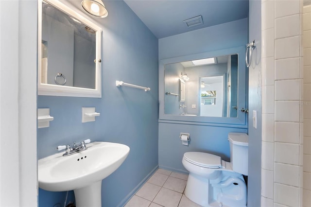 bathroom featuring tile patterned flooring, sink, and toilet