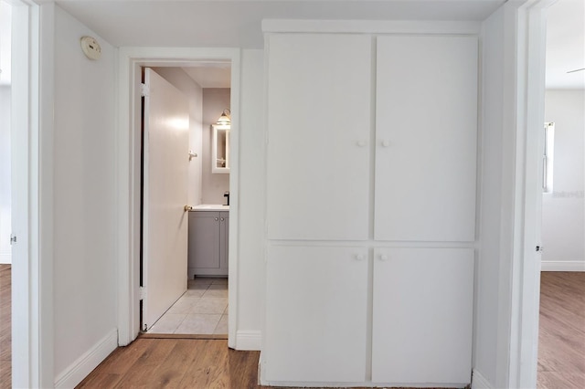 hall with light hardwood / wood-style flooring