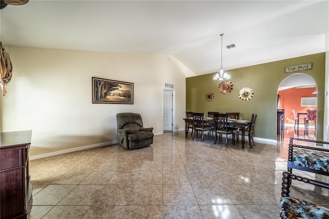 dining space featuring lofted ceiling