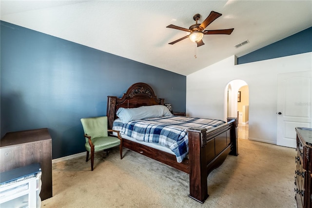 bedroom featuring ceiling fan, vaulted ceiling, and light carpet