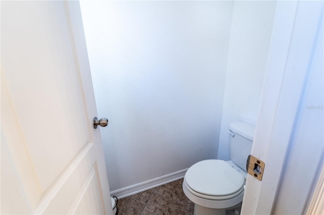 bathroom with tile patterned floors and toilet