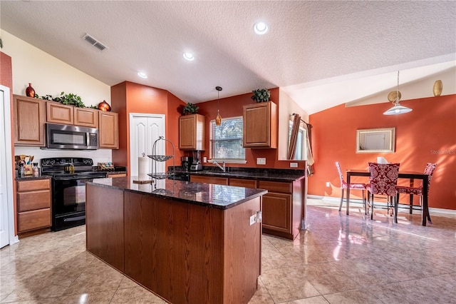 kitchen with decorative light fixtures, black electric range oven, vaulted ceiling, and a kitchen island