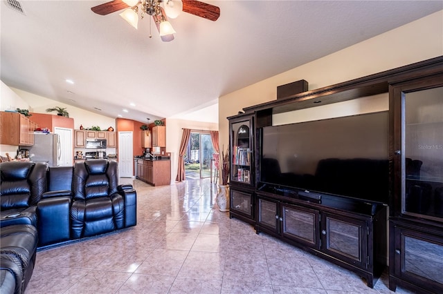 living room with ceiling fan and lofted ceiling