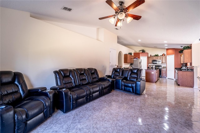 living room with ceiling fan and lofted ceiling