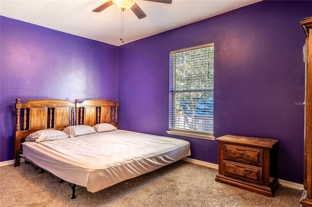 bedroom featuring light colored carpet and ceiling fan