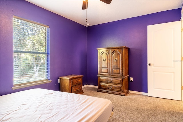 bedroom with light carpet and ceiling fan