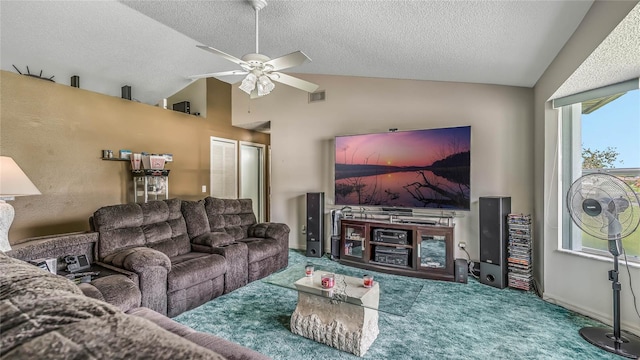 living room featuring ceiling fan, lofted ceiling, carpet floors, and a textured ceiling