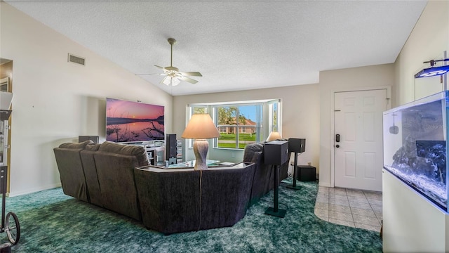 living room featuring ceiling fan, vaulted ceiling, carpet, and a textured ceiling