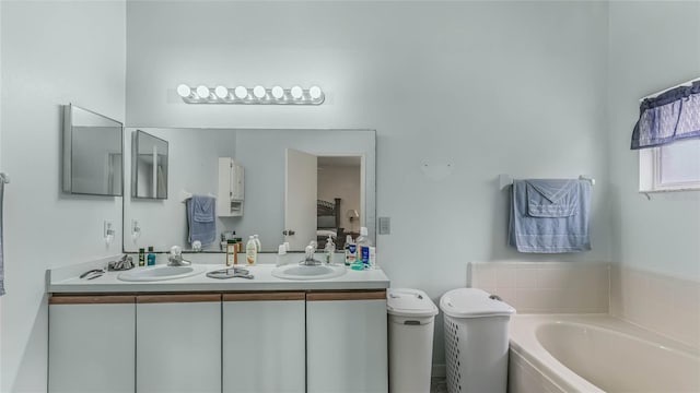 bathroom with vanity and a bathing tub