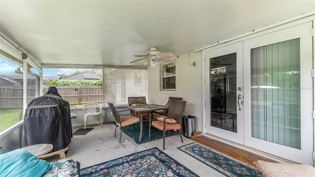 sunroom / solarium with plenty of natural light and ceiling fan