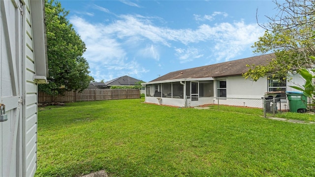 view of yard featuring a sunroom