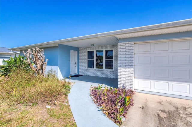 entrance to property featuring a garage