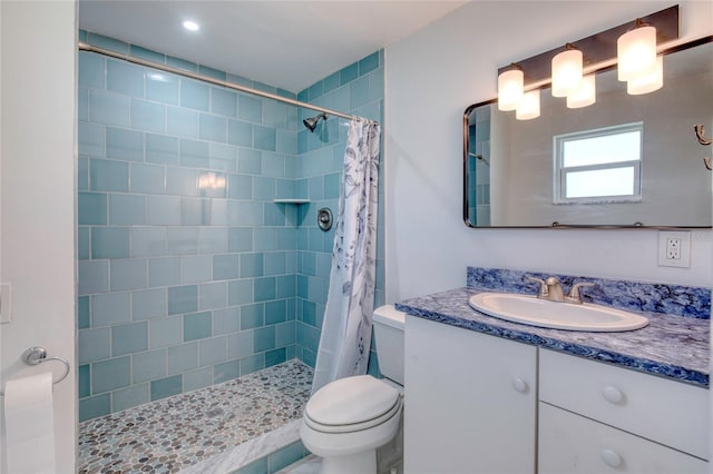 bathroom with vanity, toilet, and a shower with curtain