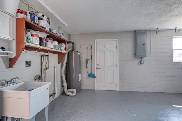 clothes washing area featuring sink, electric panel, water heater, and a textured ceiling