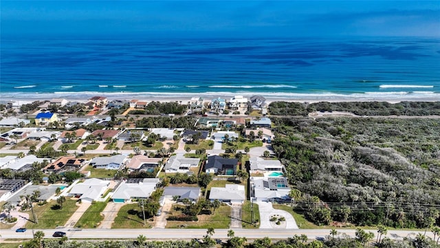 aerial view with a beach view and a water view