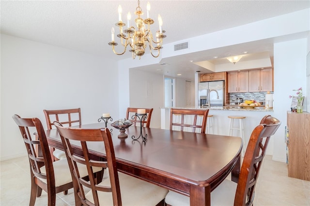 dining room featuring a textured ceiling