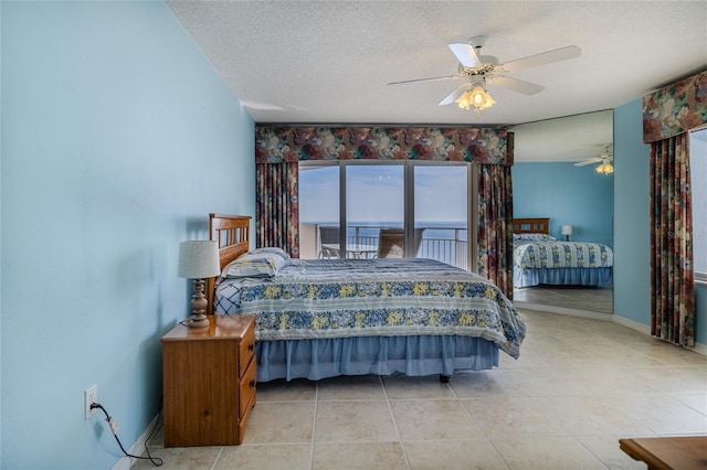 bedroom with ceiling fan, a textured ceiling, and light tile patterned flooring