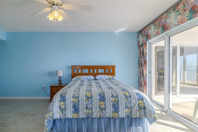 bedroom featuring ceiling fan, light tile patterned floors, access to outside, and a textured ceiling