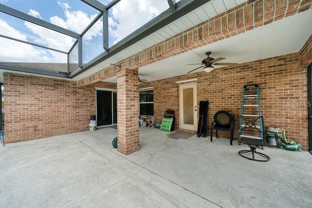 view of patio / terrace with ceiling fan and glass enclosure