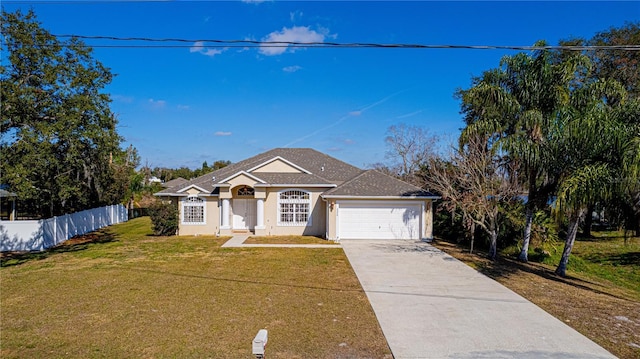 ranch-style house with a garage and a front lawn