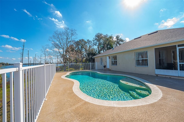 view of swimming pool with a patio area