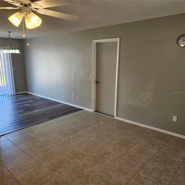 unfurnished room with ceiling fan