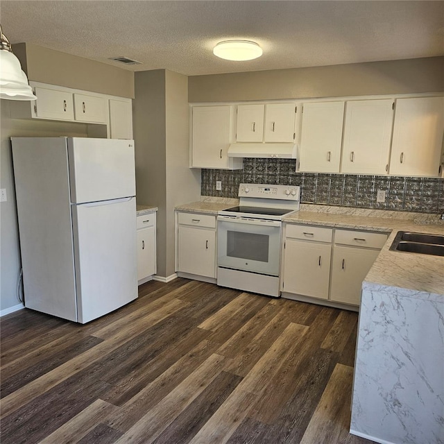 kitchen featuring white cabinetry, white appliances, dark hardwood / wood-style flooring, and tasteful backsplash