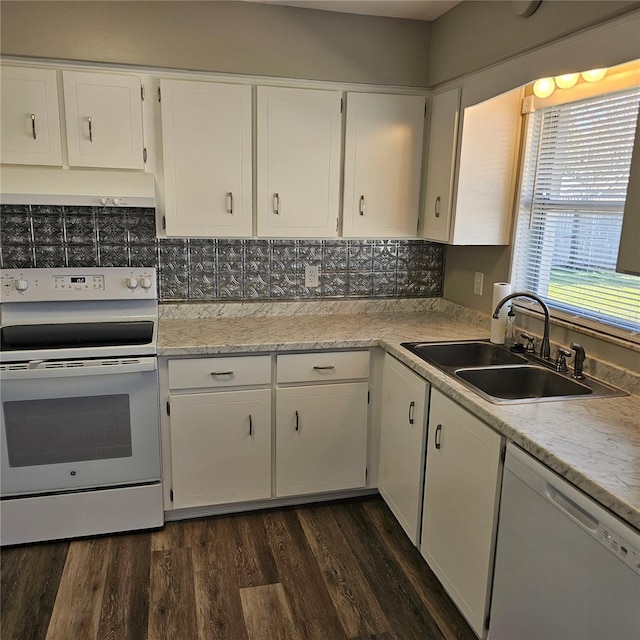 kitchen with dark hardwood / wood-style flooring, sink, white appliances, and white cabinets