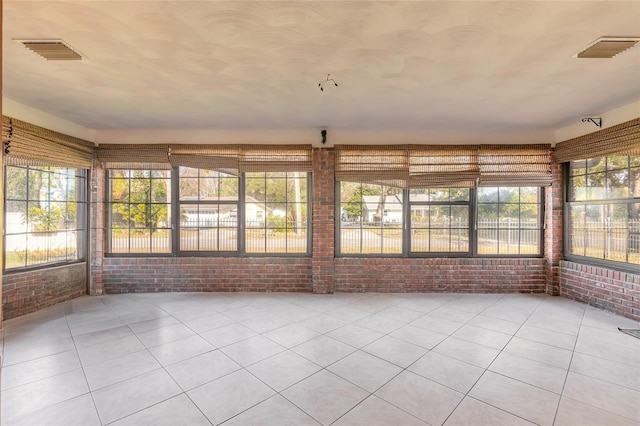 unfurnished sunroom with a healthy amount of sunlight