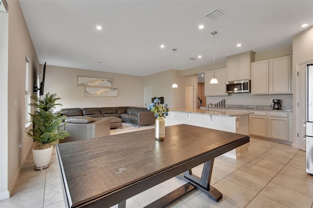 tiled dining space with sink