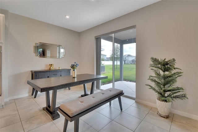 dining area featuring light tile patterned floors