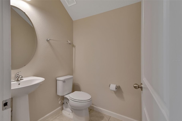 bathroom featuring sink, tile patterned floors, and toilet